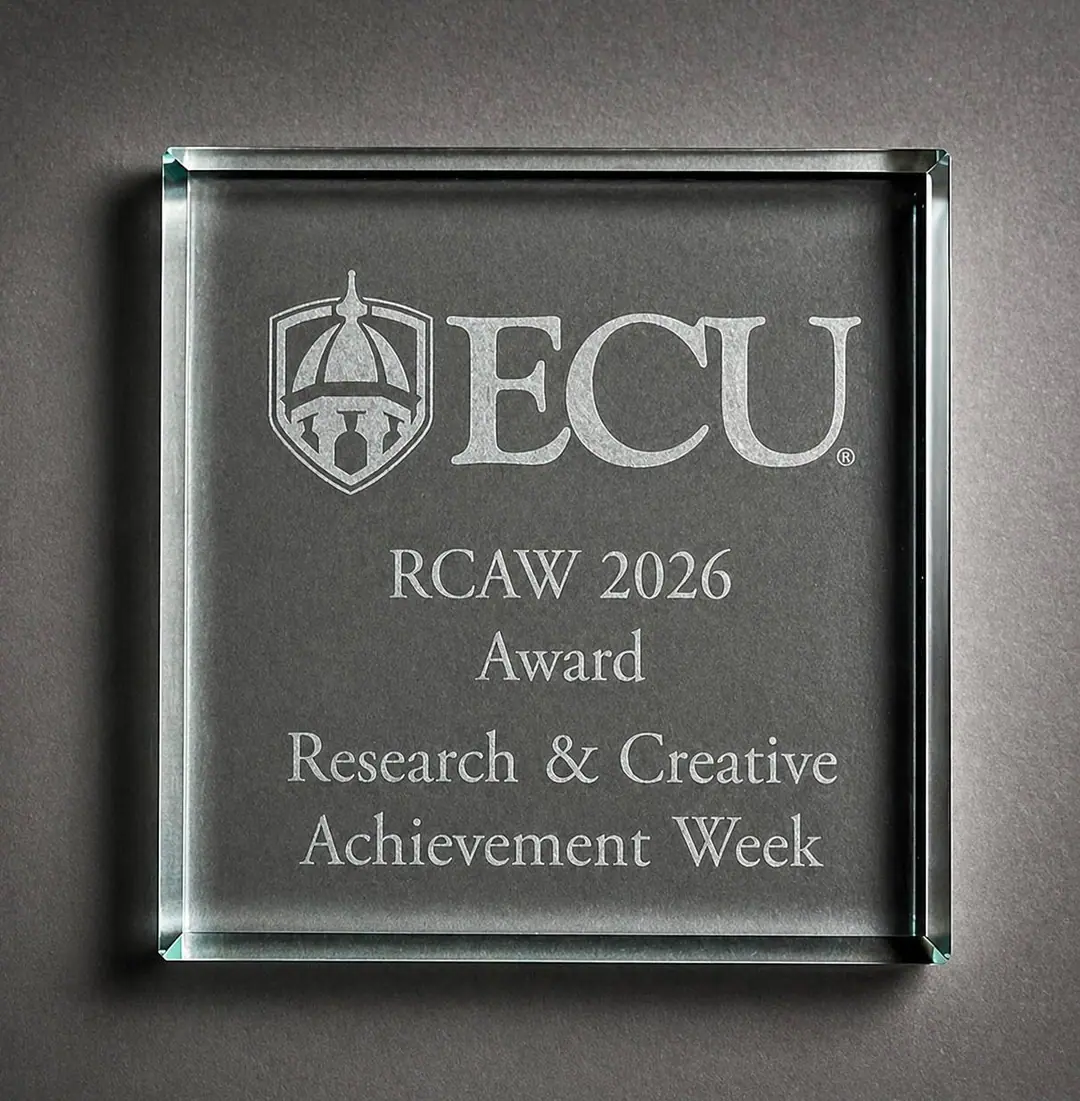 Glass award engraved: ECU RCAW 2026 Award, Research & Creative Achievement Week
