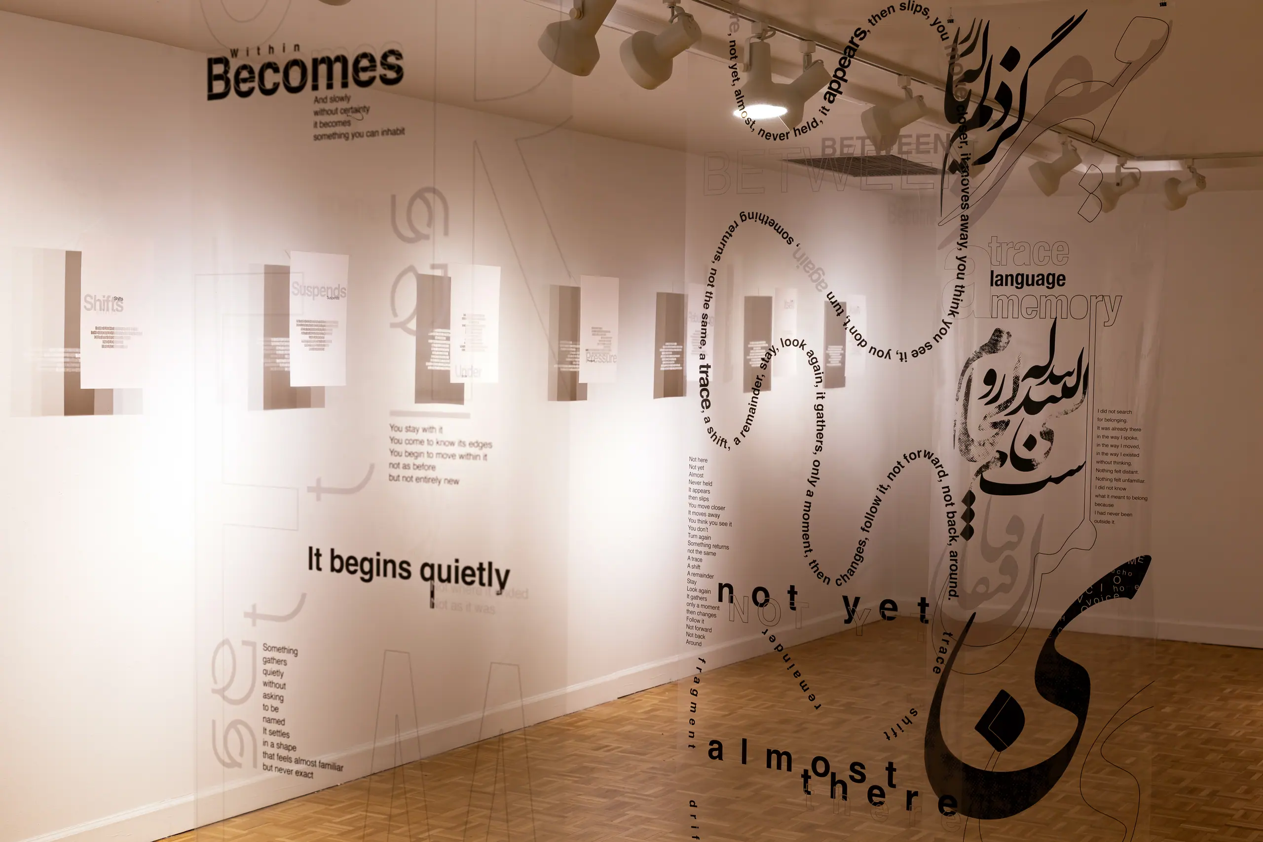Gallery view: transparent layers of English and Persian type — 'Becomes', 'It begins quietly', 'not yet', 'almost there' — suspended in front of hanging text panels